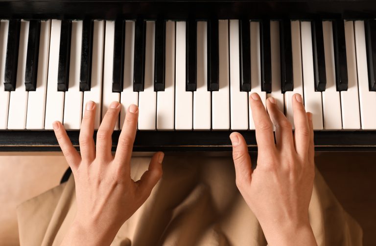 Young woman playing piano